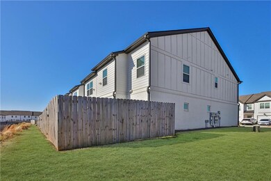 View of side of property featuring brick siding, f