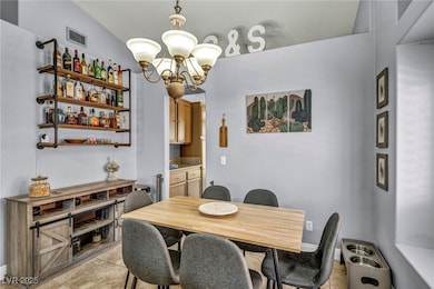 Dining room featuring baseboards, visible vents, a