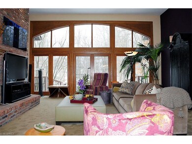 Great Room with fireplace, wet bar. wall of window