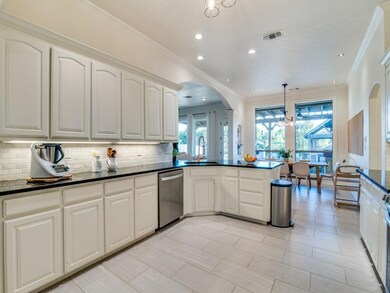 Kitchen with an inviting chandelier, hanging light