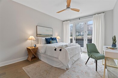 Bedroom featuring access to outside, light wood-type flooring, and ceiling fan