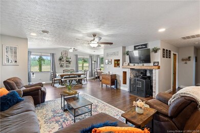 HUGE LIVING ROOM OPENS TO THE KITCHEN AND DINING A