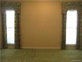 View of the living room/office showing custom drap