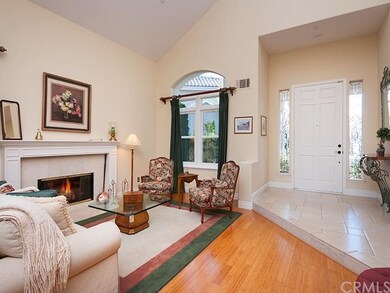 formal living room with bamboo flooring and a fire