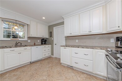 Bright Kitchen with Tile Floor and Plentiful Cabin