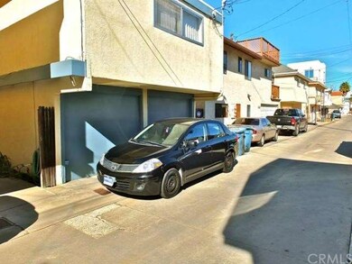 Alley garage entry with extra parking space off al