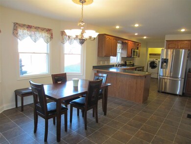 The eat-in Kitchen has a bay window by the table.
