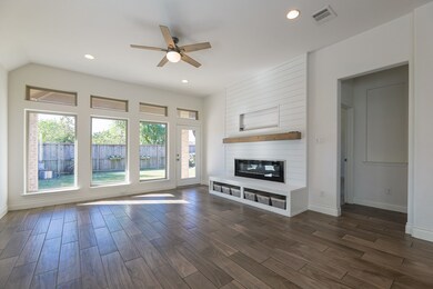 Living room with plenty of natural light and firep