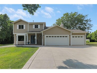 Welcoming front porch & oversized 3-car driveway