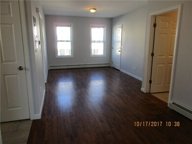 Living room facing entry door.