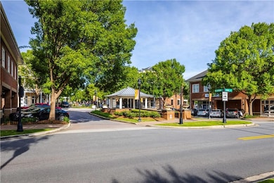 View of road with sidewalks, street lighting, curb