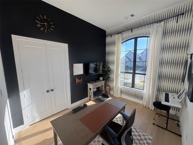Home office with baseboards and light wood-type flooring