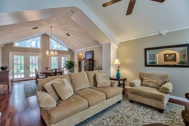 The living room is open to the dining room and off