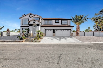View of front facade with concrete driveway, stucc