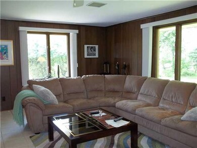 Family Room. Family room is bright and has a door 