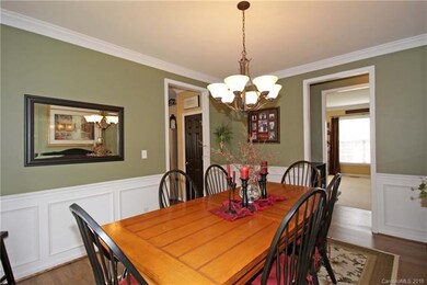Oversized formal dining room with hardwood floors,