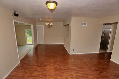This living room view highlights the open floor pl