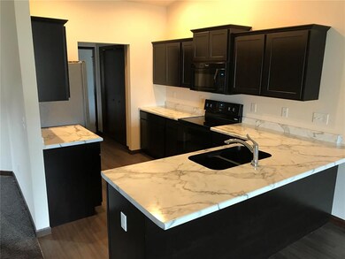 Open kitchen with lots of cabinets and counter spa