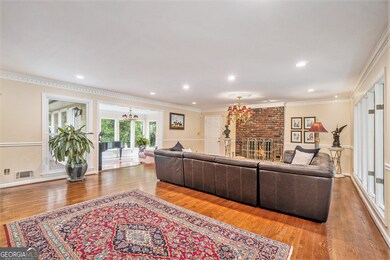 Step inside to find a Warm and Inviting Interior. Gleaming Hardwood Floors, Classic Crown Molding, and a Light-Filled, Open Concept Fireside Family Room welcome you home.