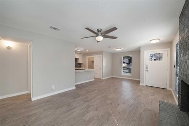 Unfurnished living room with visible vents, a fir