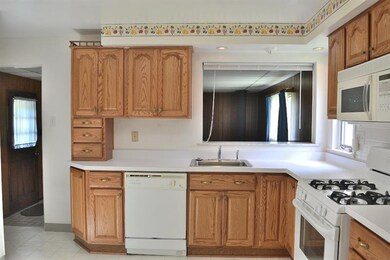 The kitchen has a full array of appliances, which 