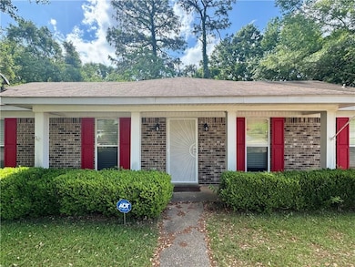 Single story home with roof with shingles, covered