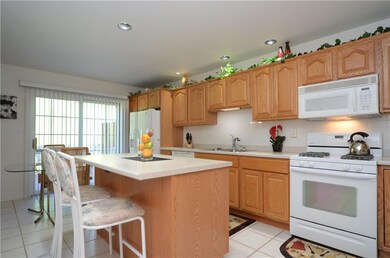 Large kitchen with ceramic tile, kitchen island, p