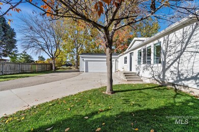 View of property exterior with driveway and an attached garage