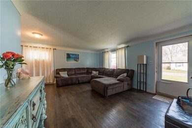 21' x 15' Living Room with hardwood floors.
