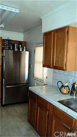 Galley Kitchen with Tile Counter Tops