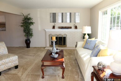 Bright & Open with original fireplace.