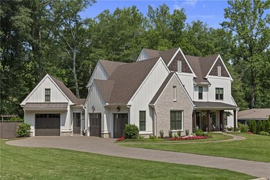 For added convenience, this home features a spacious three-car garage, including an oversized bay fully floored for extensive storage. A built-in motorized lift allows effortless transport of boxes and seasonal items to the upper level - all with the