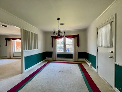 Formal dining room and a chandelier; carpet over h