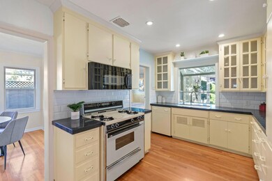 Upgraded Kitchen overlooking backyard, very bright