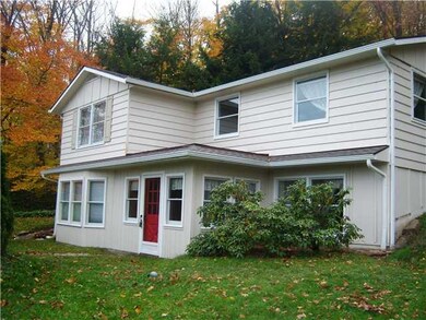 Exterior Front New Tear-Off Roof and Seamless Gutt
