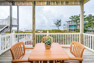 Covered porch overlooking beach