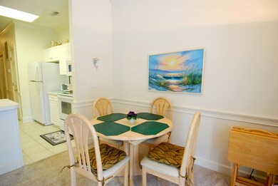 Dining room with wainscoting, light tile patterned