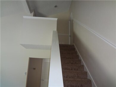 Stairs leading to unfinished room