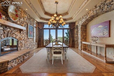 Dining room with wood burning stone fireplace, dou