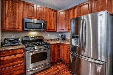 The kitchen comes equipped with stainless steel ap