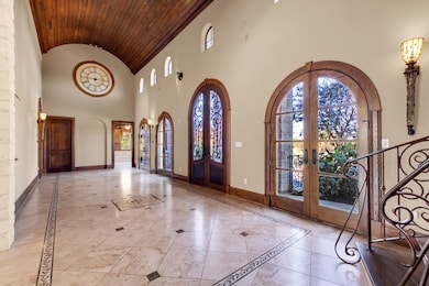 Step into a breathtaking foyer that immediately im