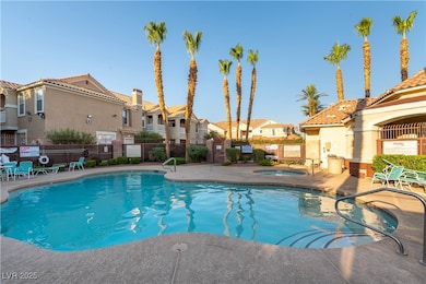 Community pool featuring a residential view, a com