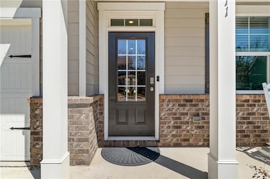 View of exterior entry with stone siding