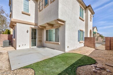 Rear view of property featuring a patio area and c