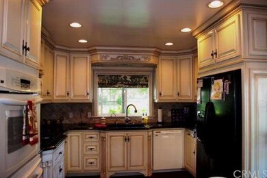 Beautiful renovated kitchen with custom cabinets.