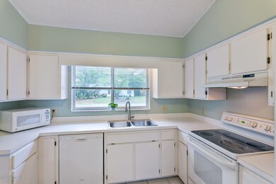 BRIGHT KITCHEN WITH LOTS OF CABINETS