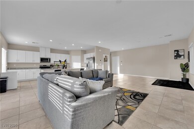 Living area featuring baseboards, visible vents, r