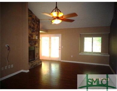 Living Room. Wood floors throughout! French doors 