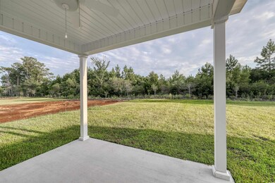 View of patio with ceiling fan