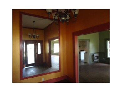 Photo. Entry way as viewed in the large wall mirro